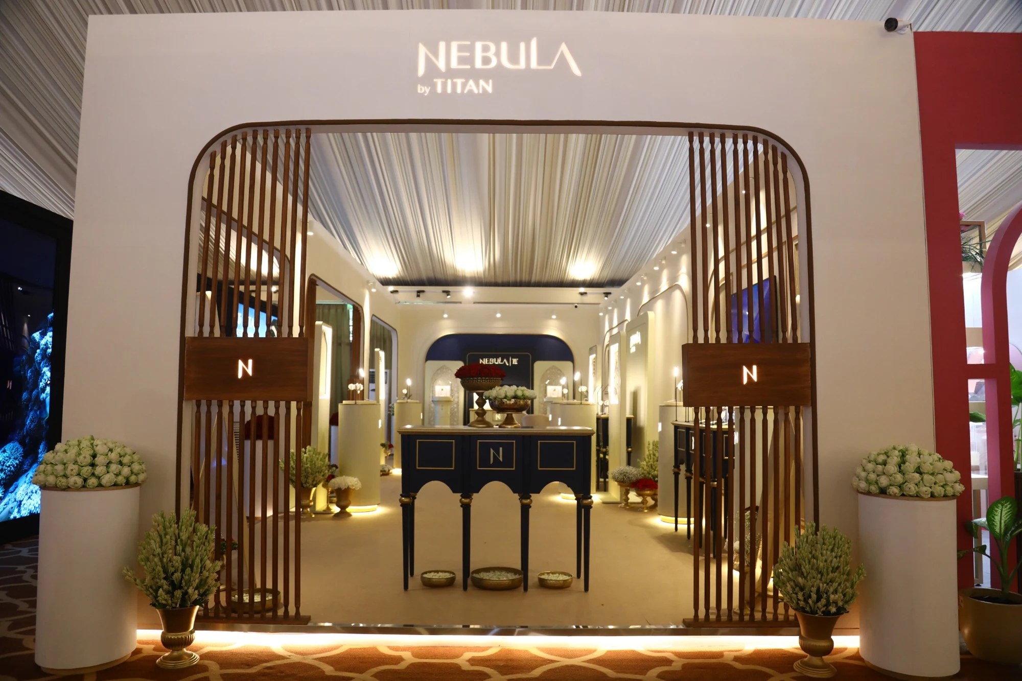 Nebula exhibition entrance framed by curved wood detailing